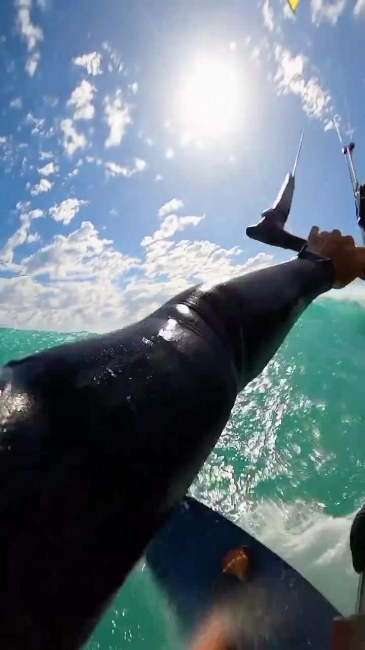 First-Person Kitesurfing Adventure in Turquoise Water