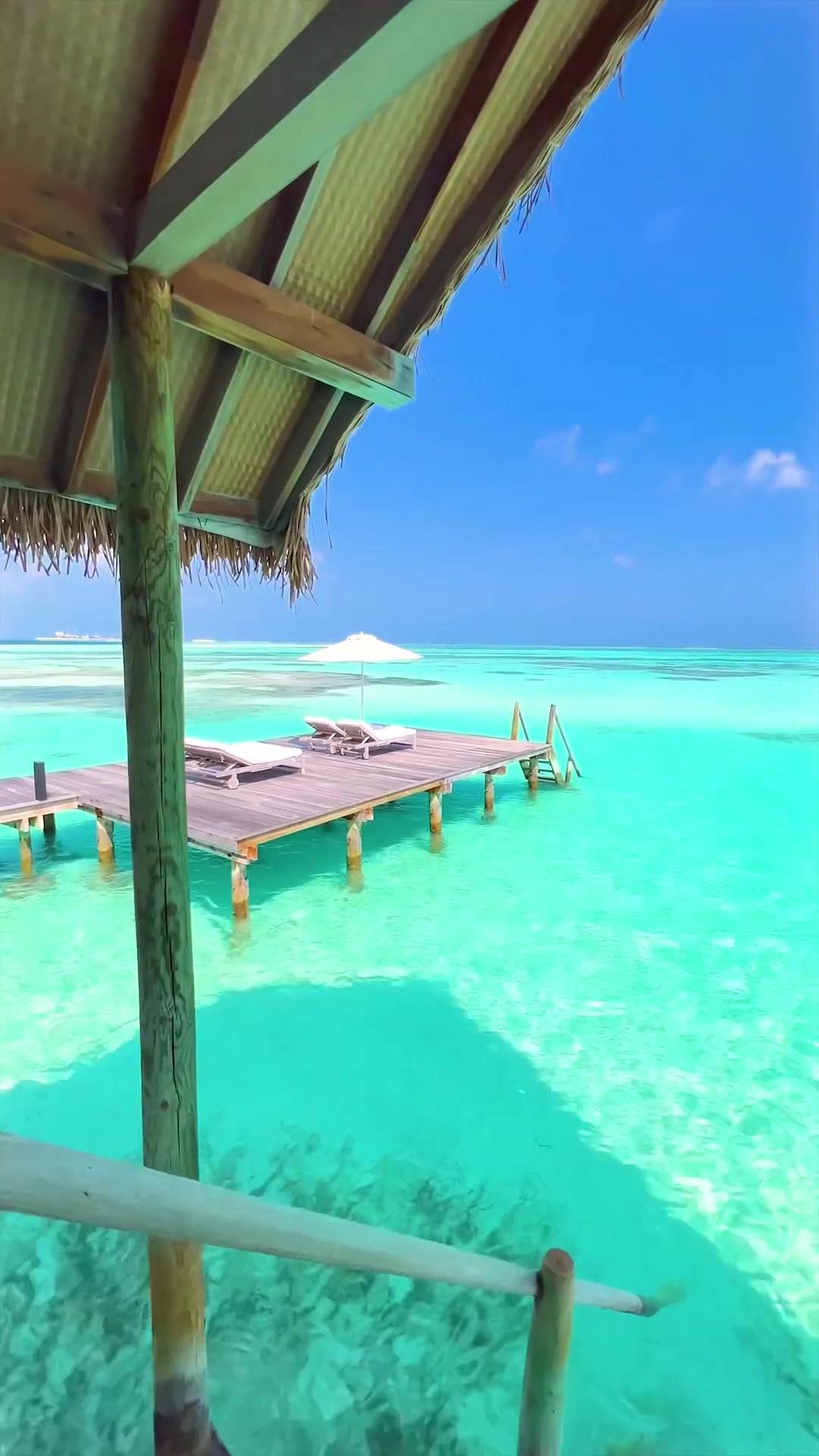 Tropical Beach View: Pier and Turquoise Water