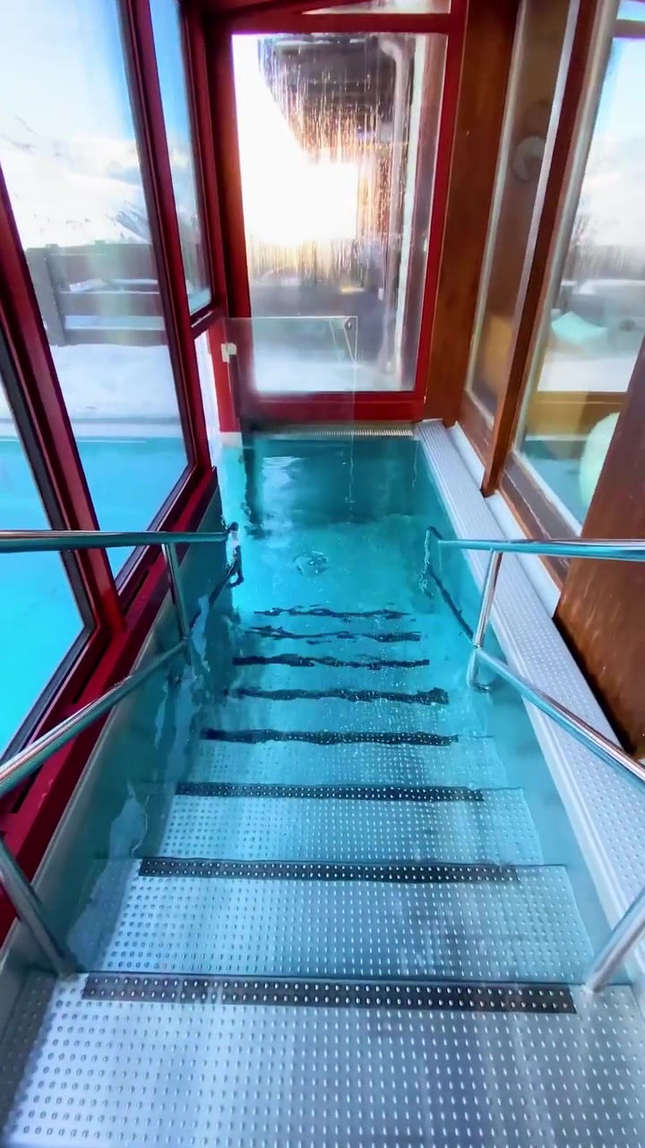 Glass-Bottomed Elevator in Snowy Mountains