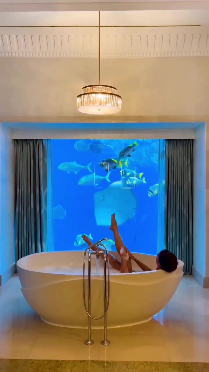 Luxury Bathtub with Aquarium View: Unique Relaxation