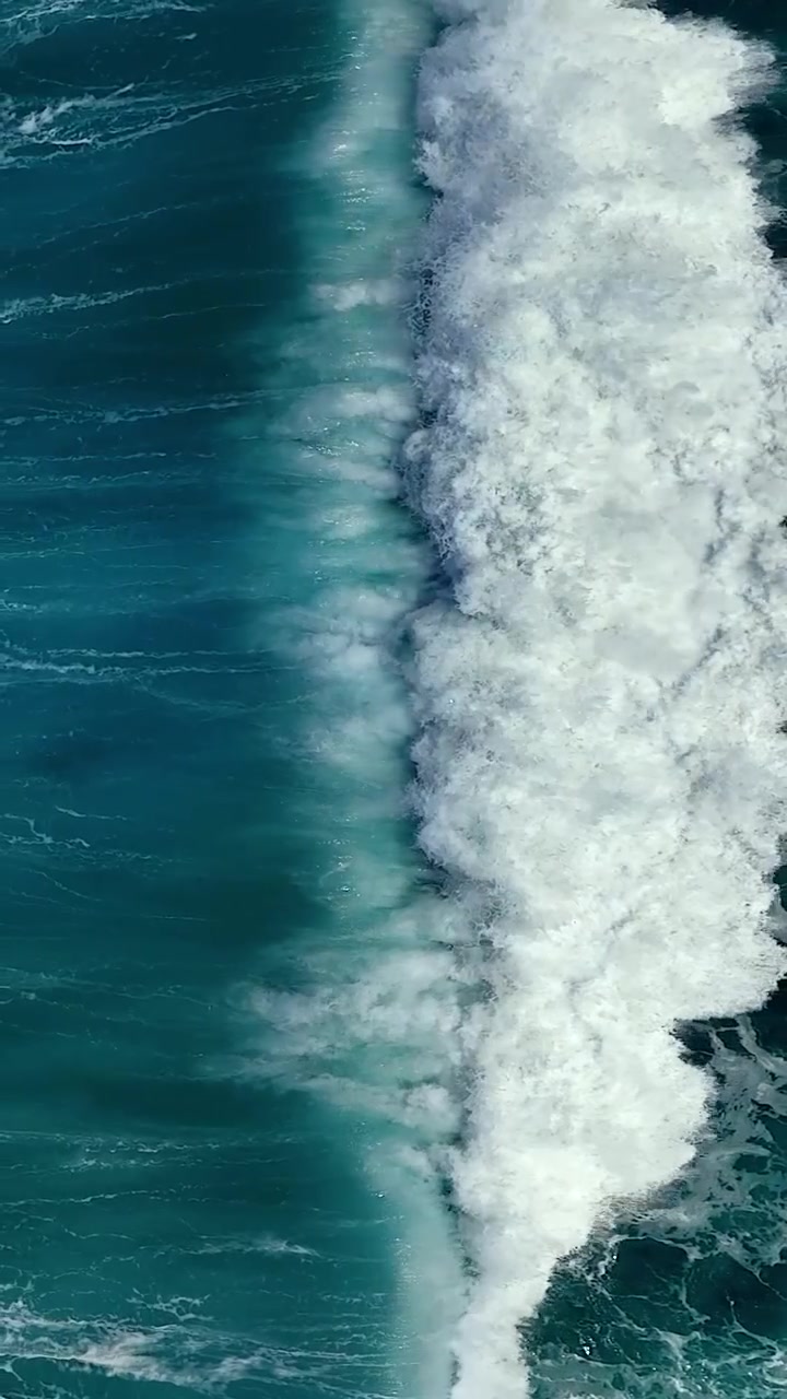 Aerial View of Ocean Wave Crashing