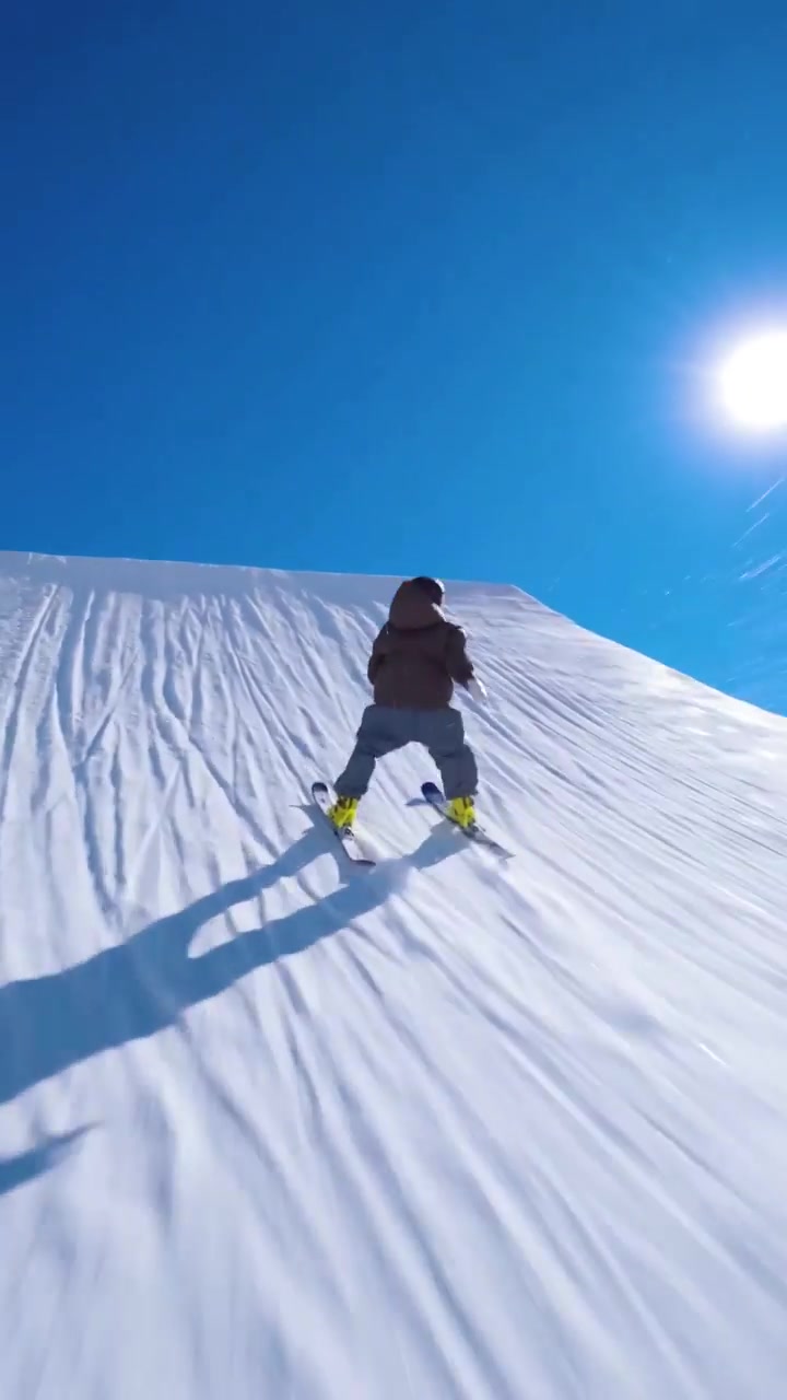 Skiing Down a Snowy Mountain Slope
