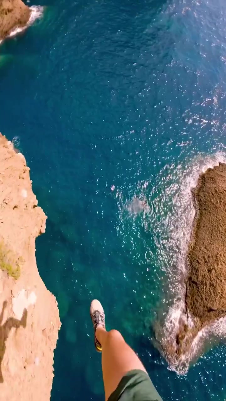 Ocean View: Rocky Cliff and Turquoise Water