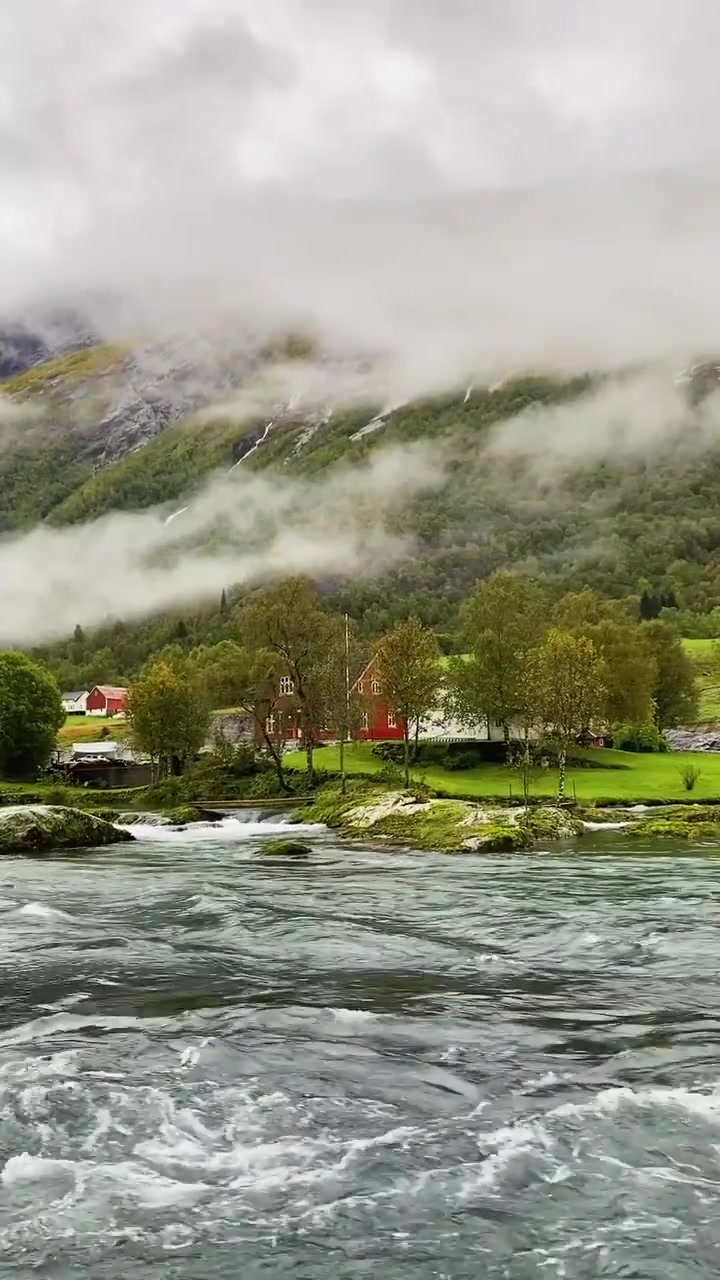 Norway's Misty Landscape with River and Village