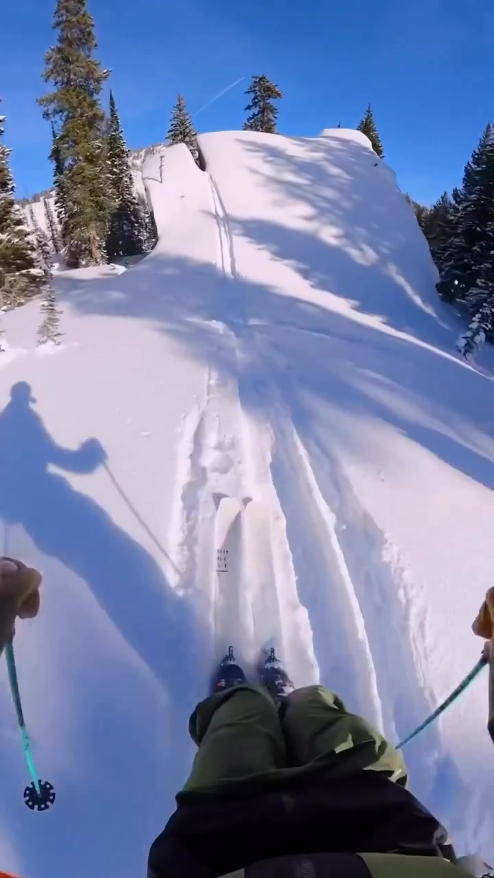 First-Person Skiing Down a Snowy Slope