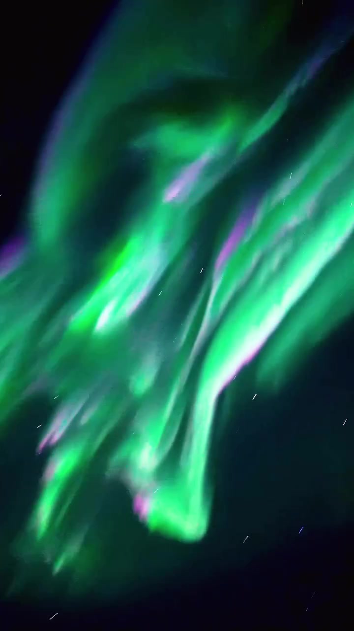 Aurora Borealis: Northern Lights Dance in Green and Purple