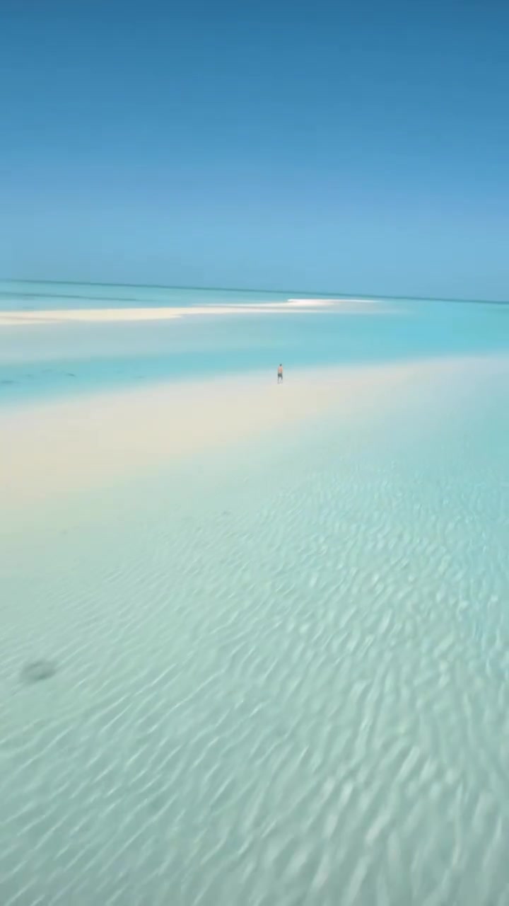 Beach Walk: Aerial View of Ocean and Sand