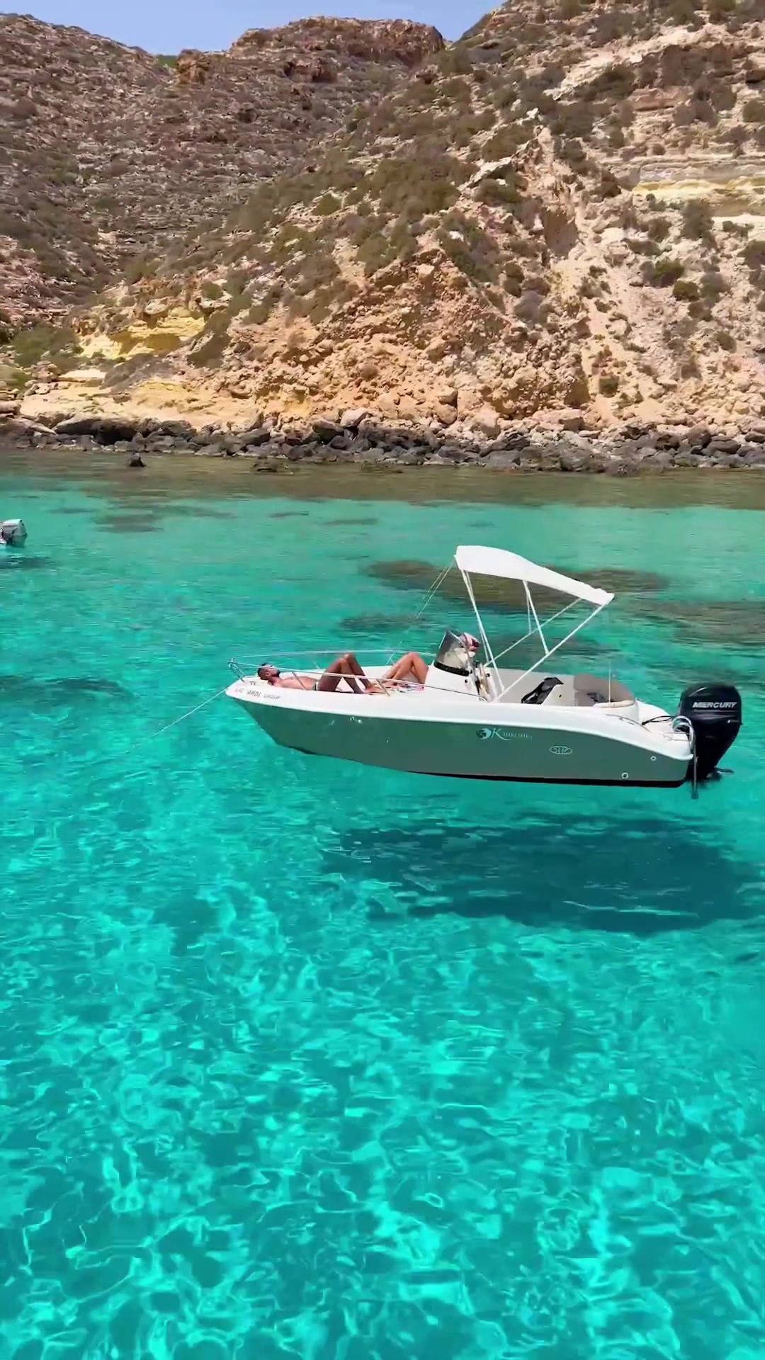 Boat Trip: Cruising Turquoise Waters Near Rocky Coast