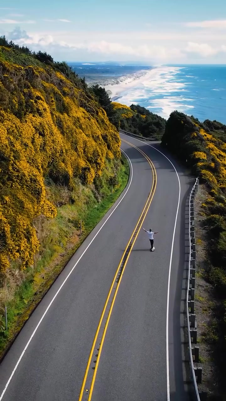Skateboarding Coastal Road with Ocean Views