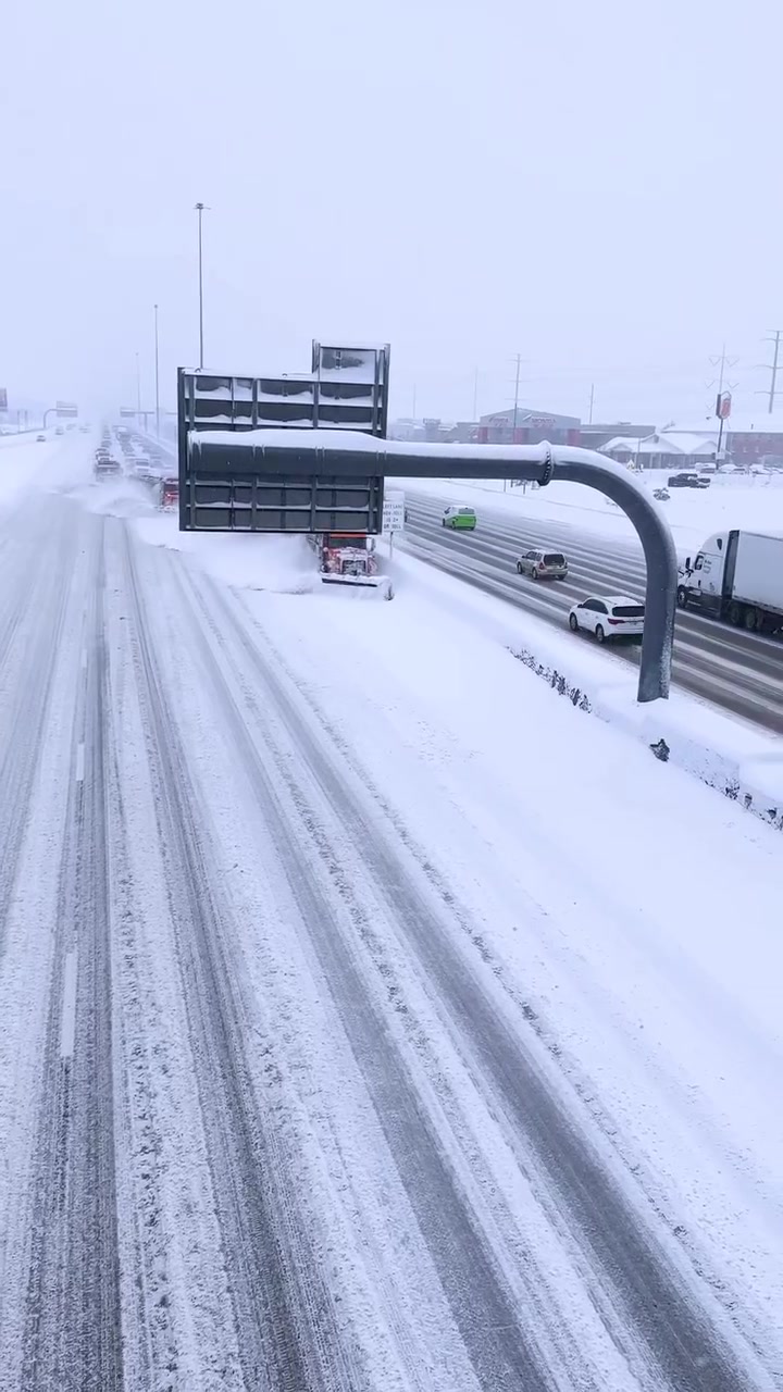 Highway Snowplow Clearing Heavy Snowfall