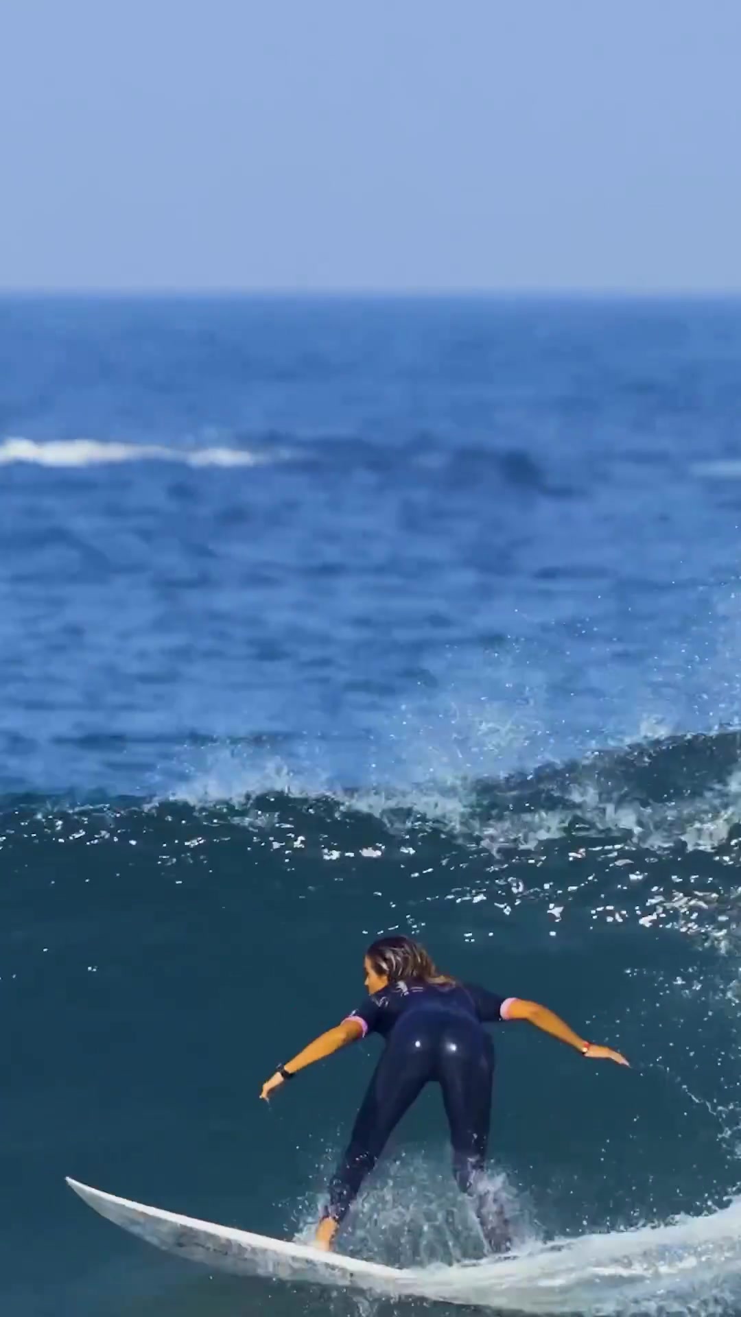 Surfer Performs Aerial Maneuvers on Big Waves