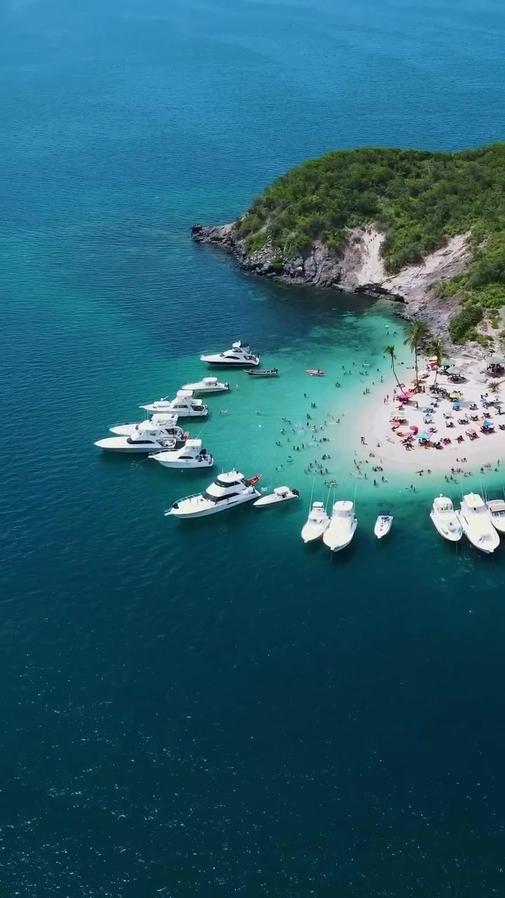 Aerial Beach Party: Crowded Scene with Boats