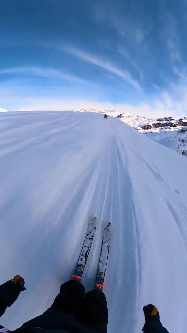 Skiing Down a Snowy Mountain with Nordroo Skis