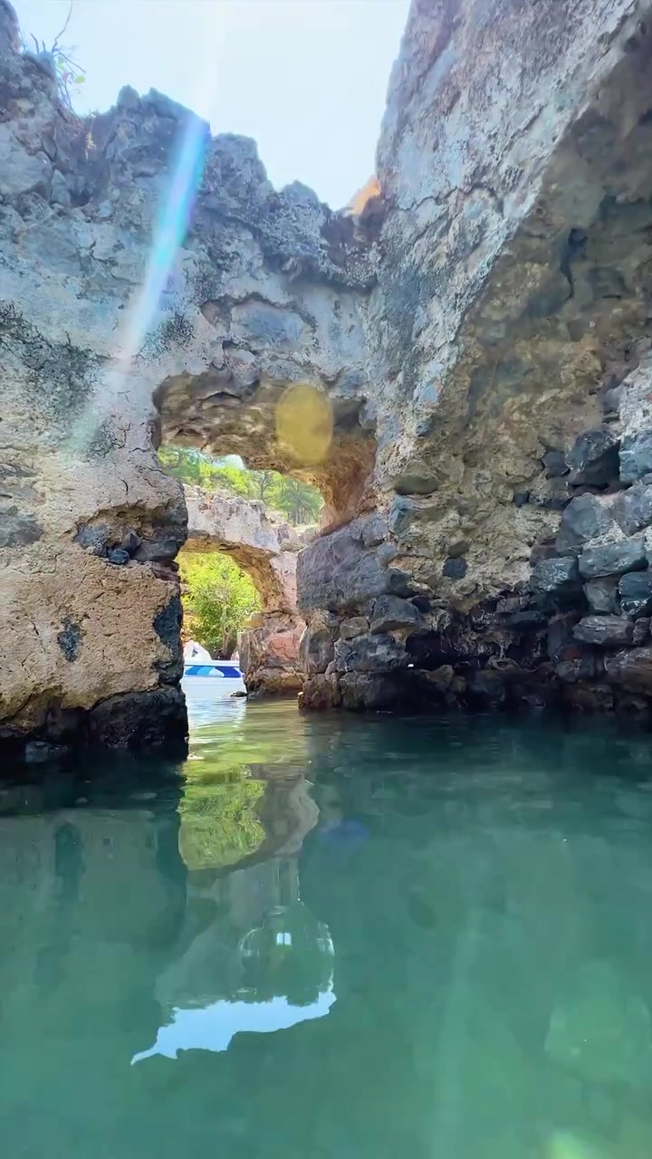 Boat Ride Through Turquoise Water and Rocky Cliffs