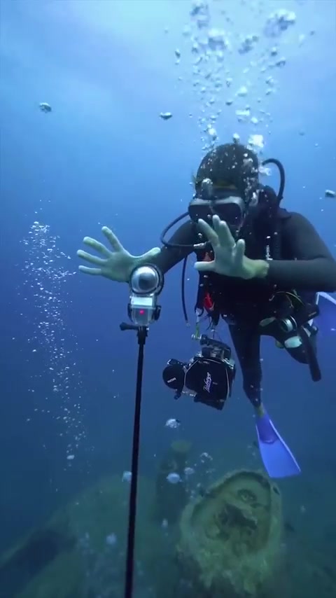 Diver Filming Shipwreck with GoPro