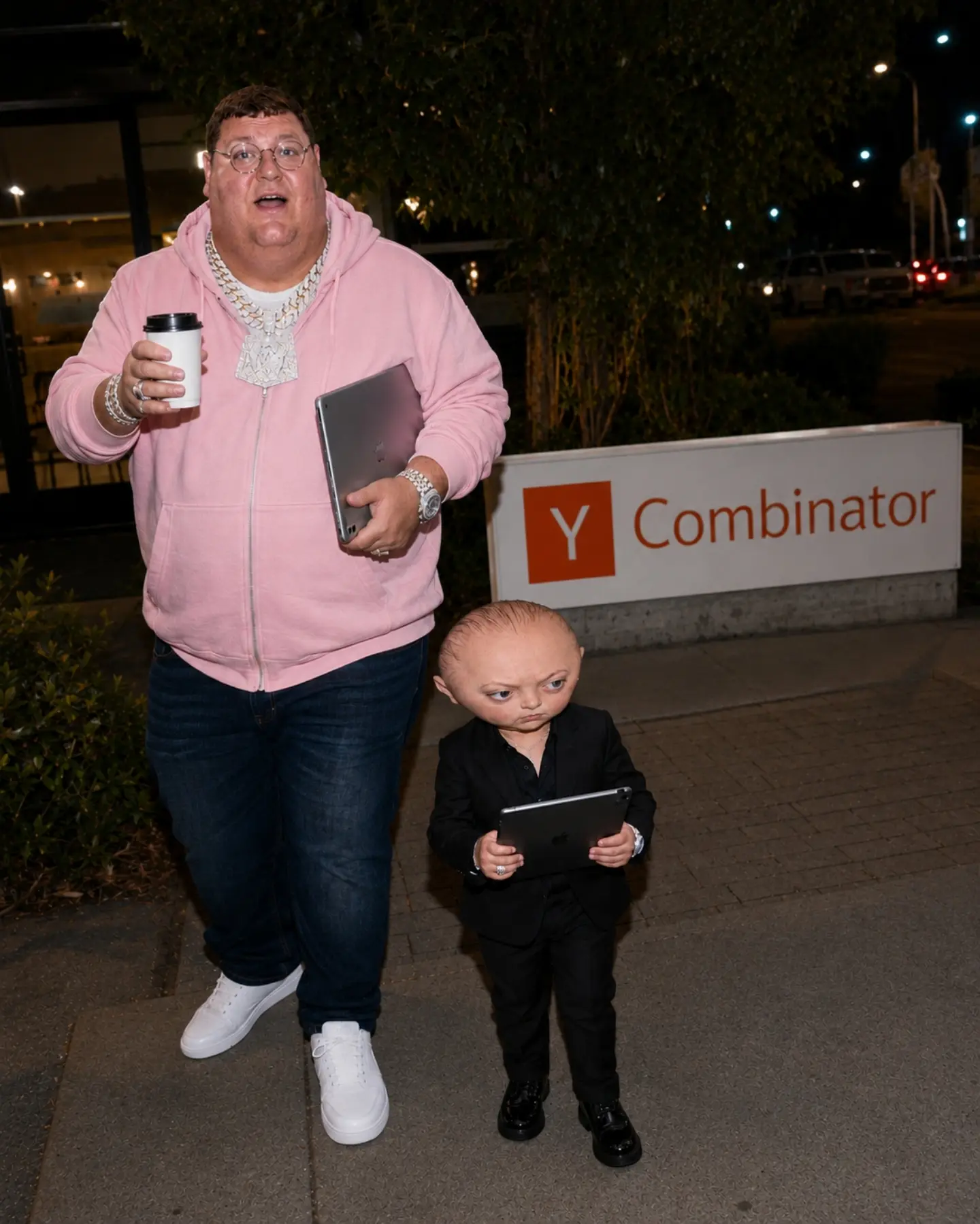 Man and Doll Walk into Building with iPads