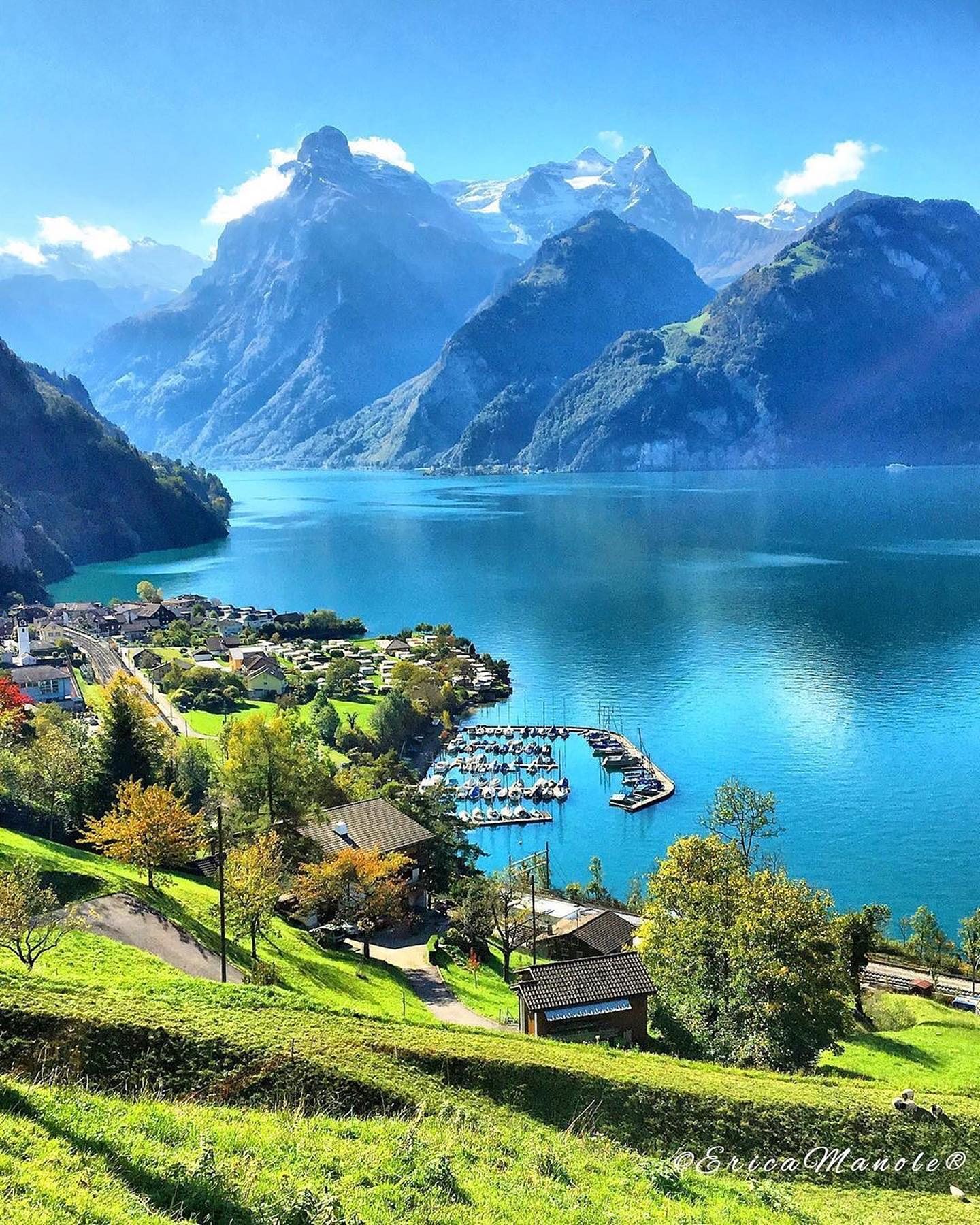 Explore a Serene Lakeside Town Amidst Majestic Mountains