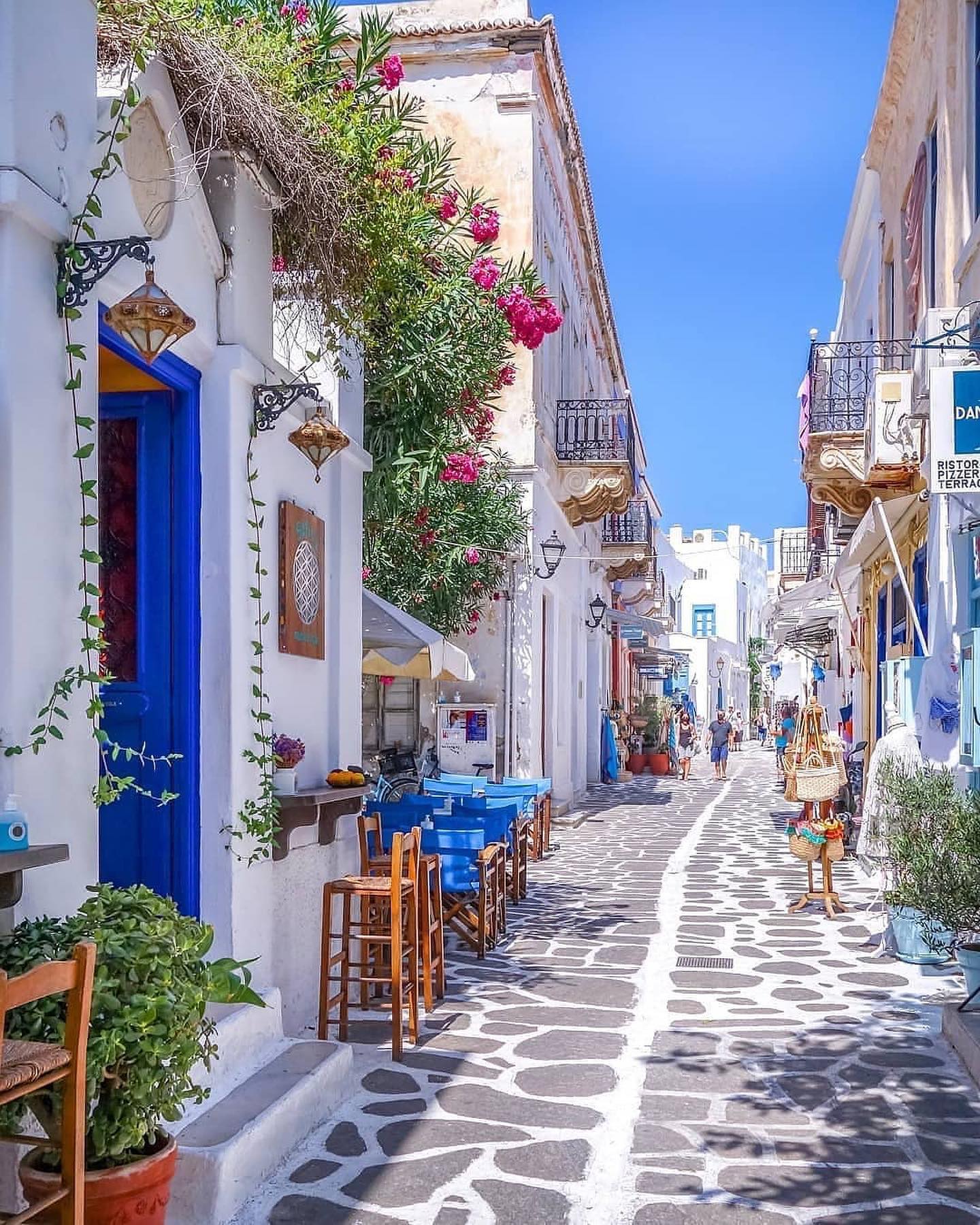 Greek Village Street: Charming Architecture and Cafes