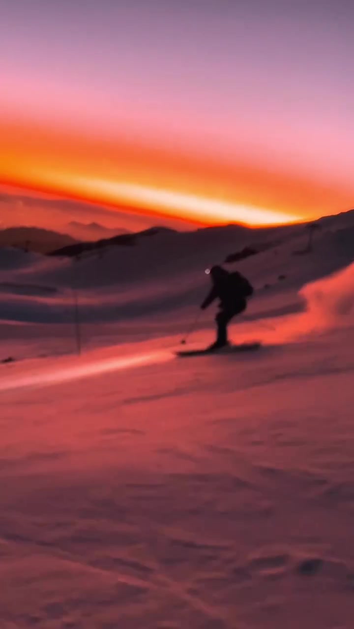 Sunset Skiing: Dramatic Mountain Descent