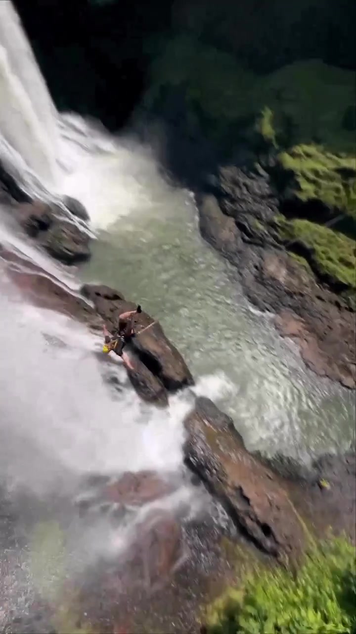 Cliff Jumping into Waterfall