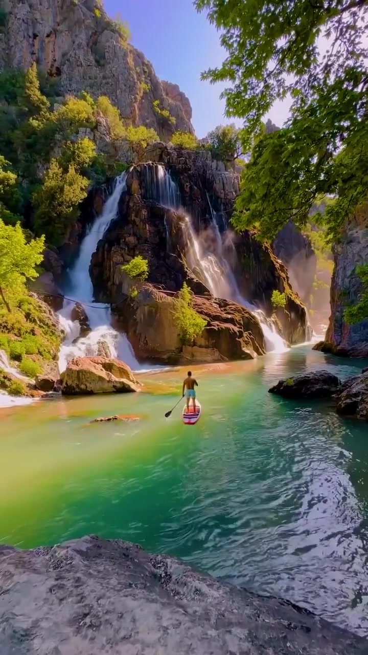 Paddleboarding at a Waterfall: River Adventure