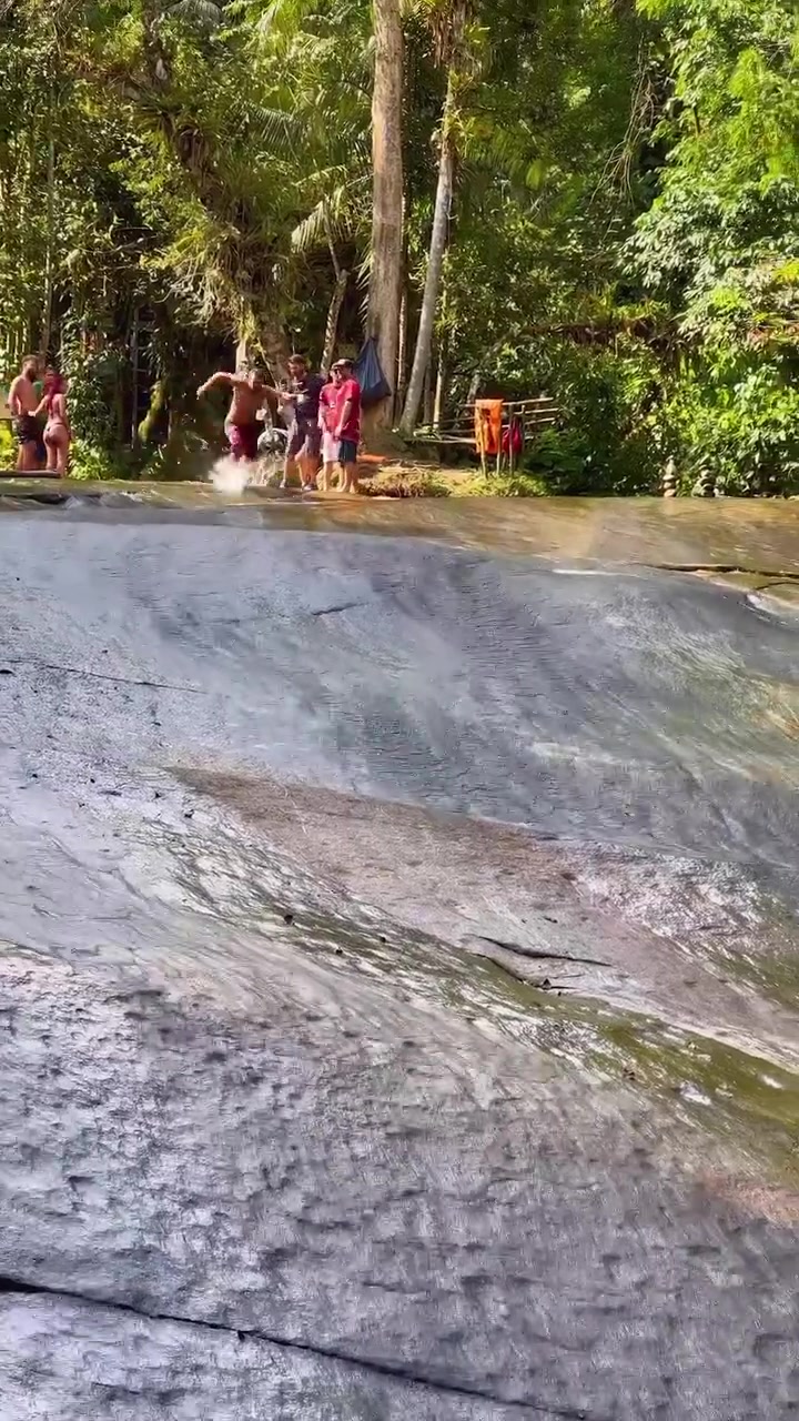 Natural Water Slide Fun in Tropical Rainforest