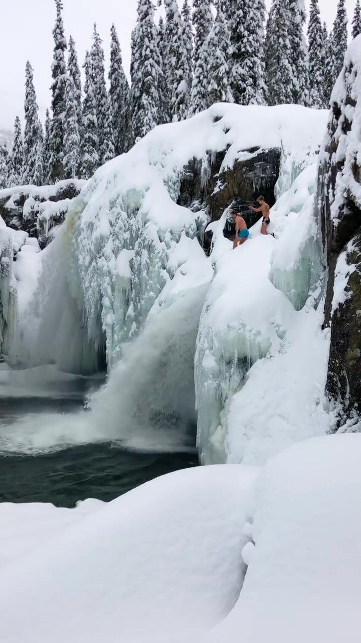Extreme Winter Activity: Cliff Jumping into Ice
