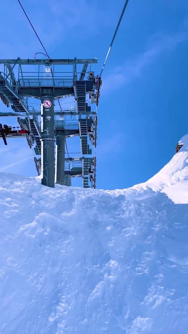 Ski Lift Ride: Mountain Views and Mechanics