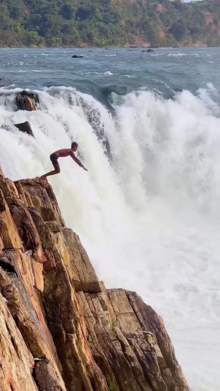 Cliff Jumping into Waterfall: Daring Stunt