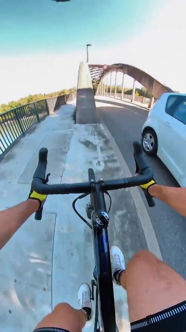 First-Person Cycling on a Scenic Bridge