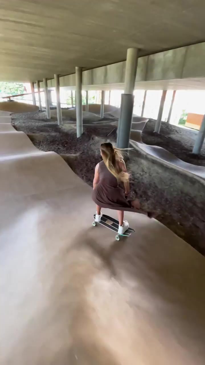 Woman Skateboarding in a Concrete Bowl