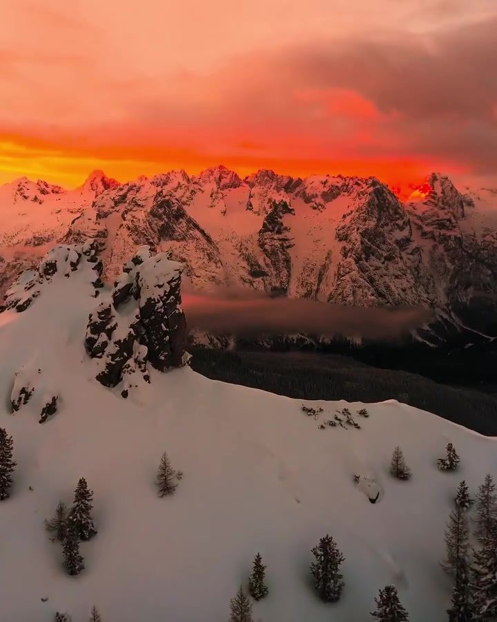 Snow-Capped Mountains and Vibrant Sunsets