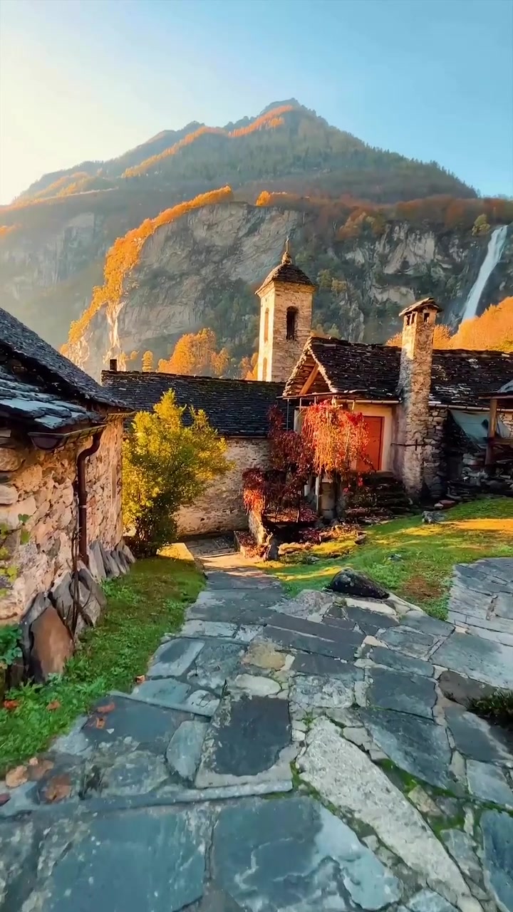 Mountain Village Autumn Scenery with Bell Tower