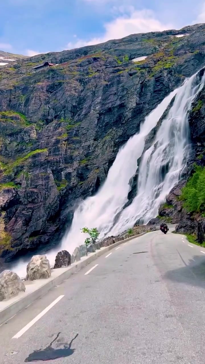 Motorcycle Ride on Scenic Road with Waterfalls