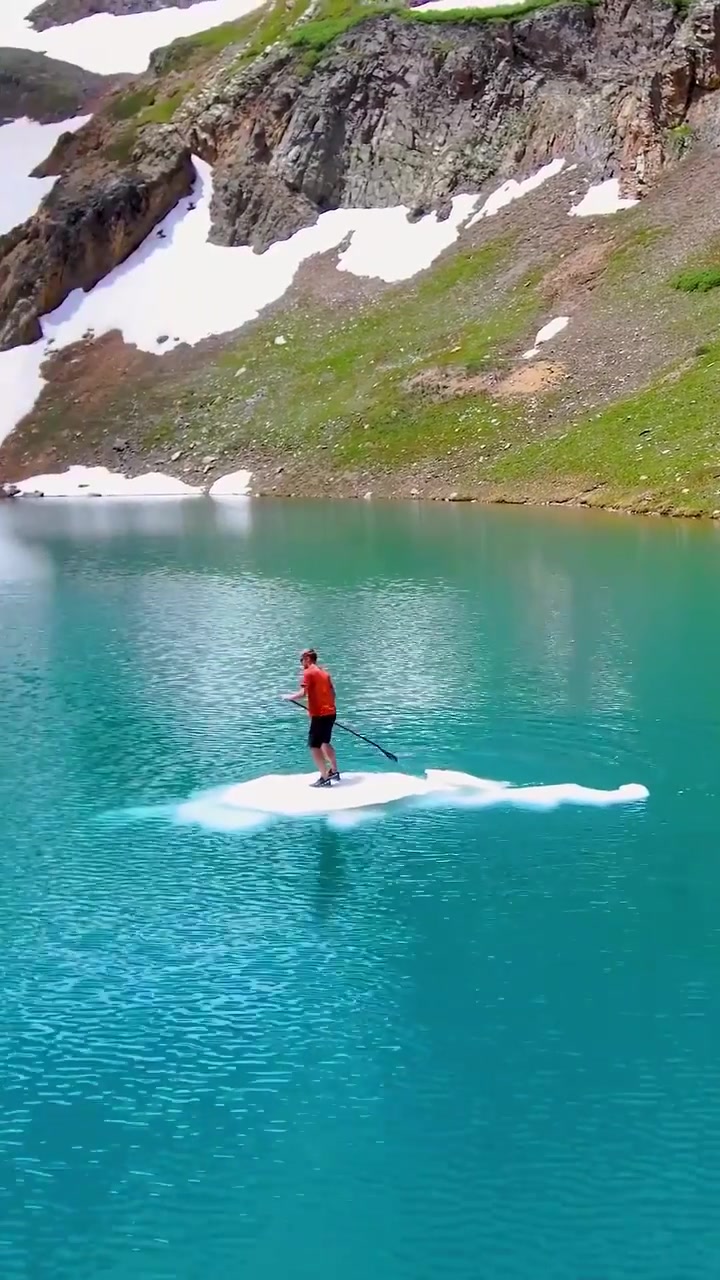 Paddleboarding on Alpine Lakes with Snow-Capped Mountains