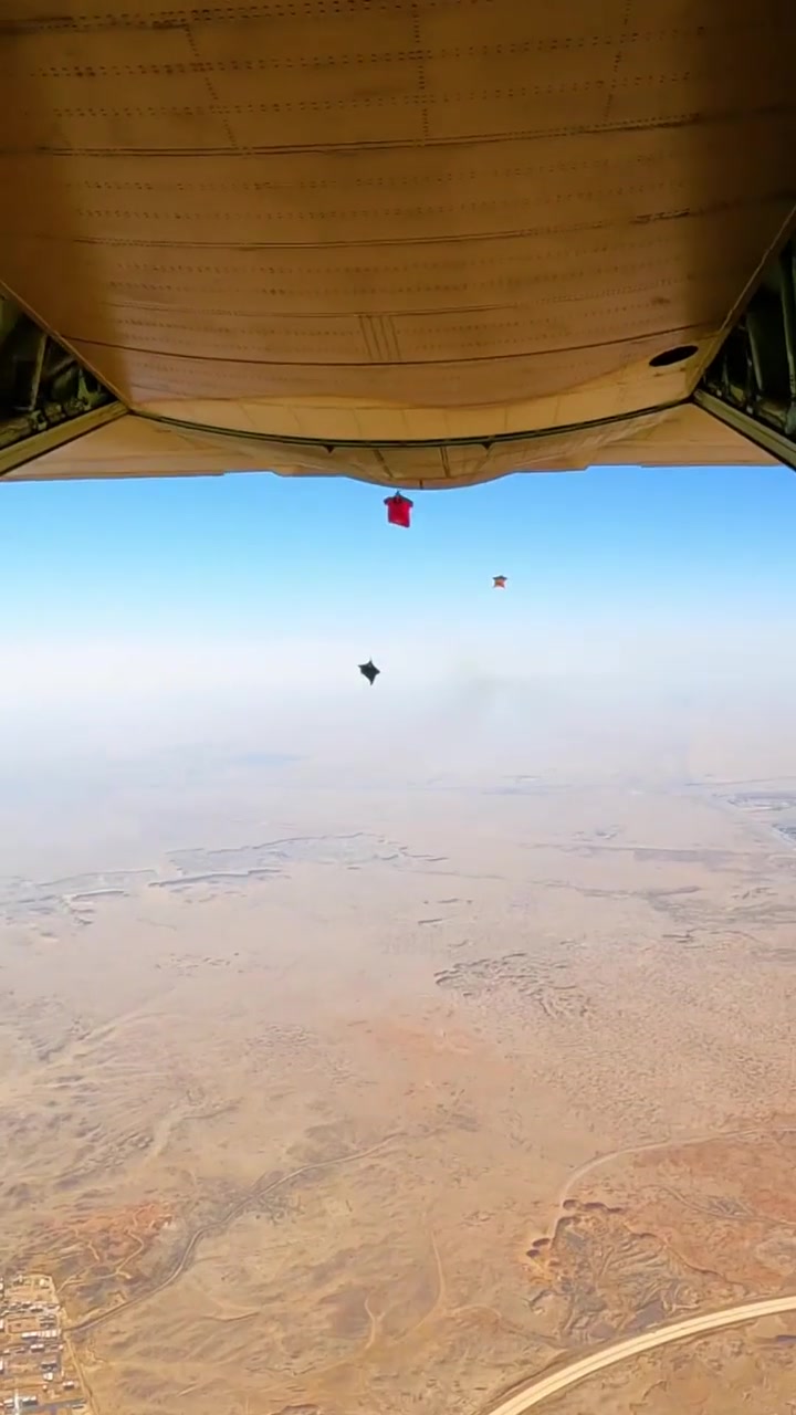 Red Bull Skydivers Jumping from Plane