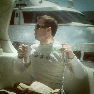 Man Enjoying Drink on Yacht