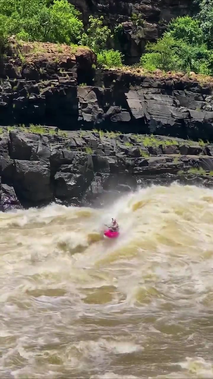 Kayaker Navigating Rapids: Skillful Maneuvers