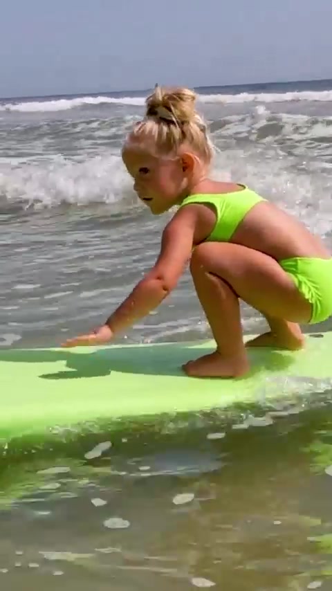 Child Surfing: Youngster's Ocean Adventure