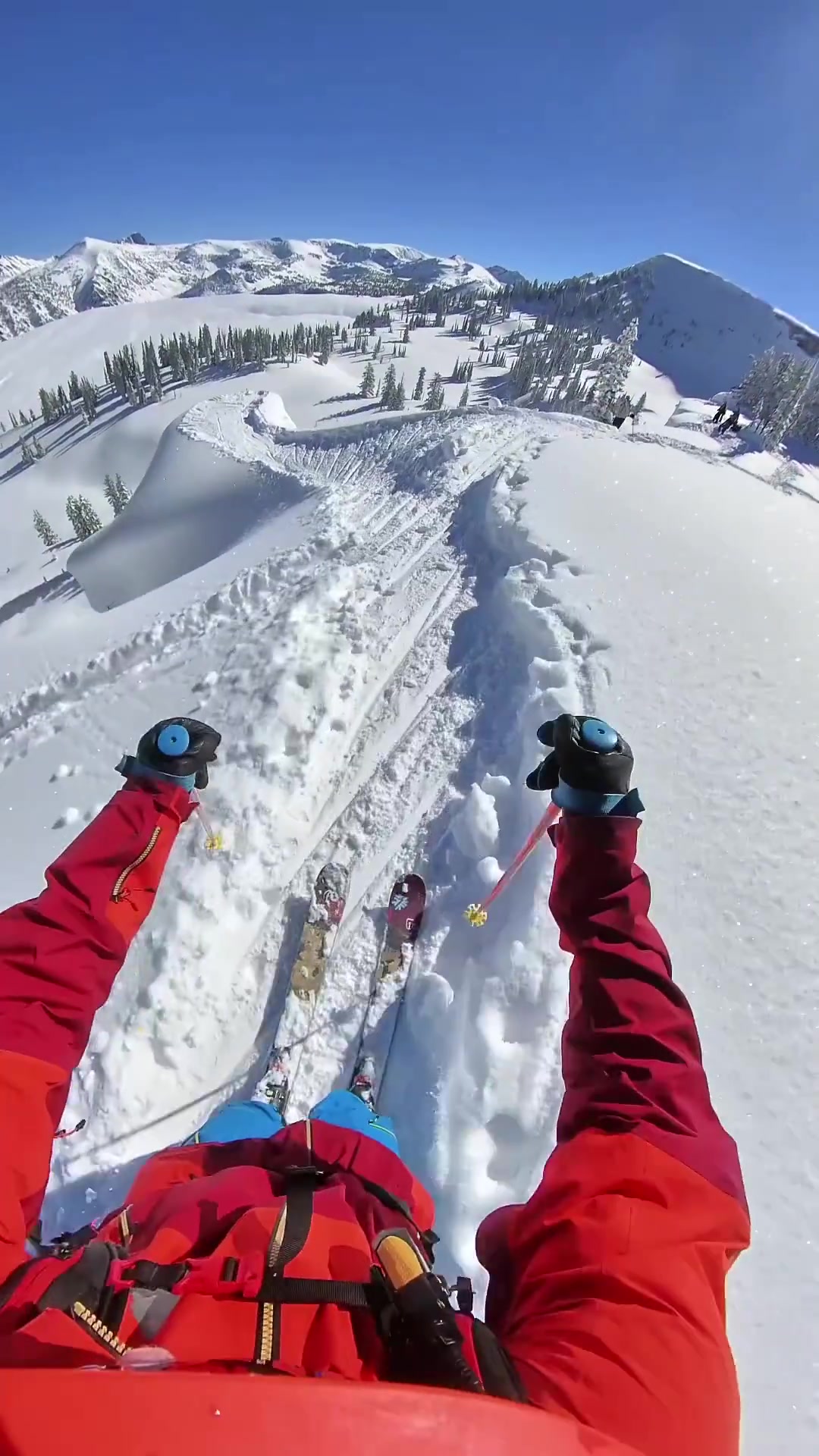 First-Person Skiing Down a Snowy Mountain